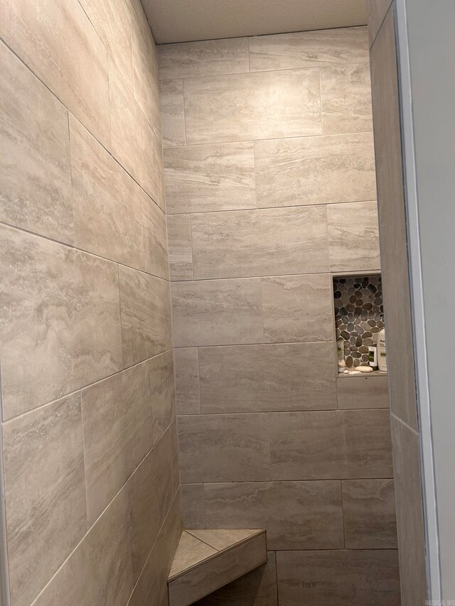 bathroom featuring tiled shower