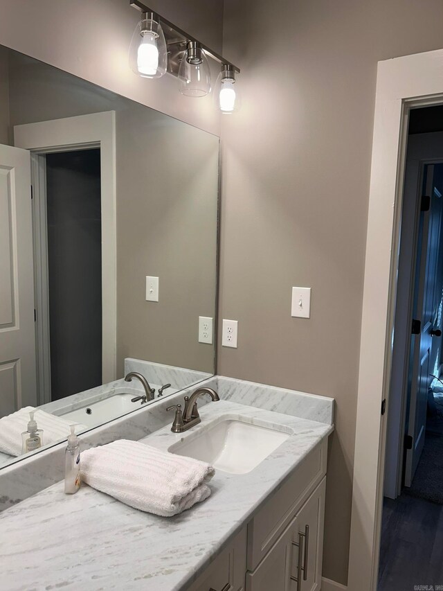 bathroom featuring vanity and wood-type flooring