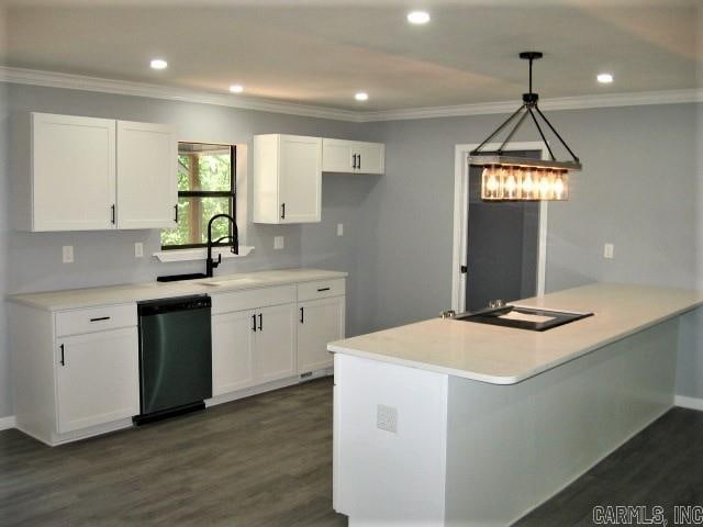 kitchen featuring black dishwasher, white cabinets, crown molding, dark hardwood / wood-style floors, and hanging light fixtures