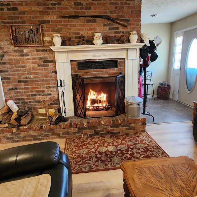 room details featuring a fireplace and hardwood / wood-style flooring