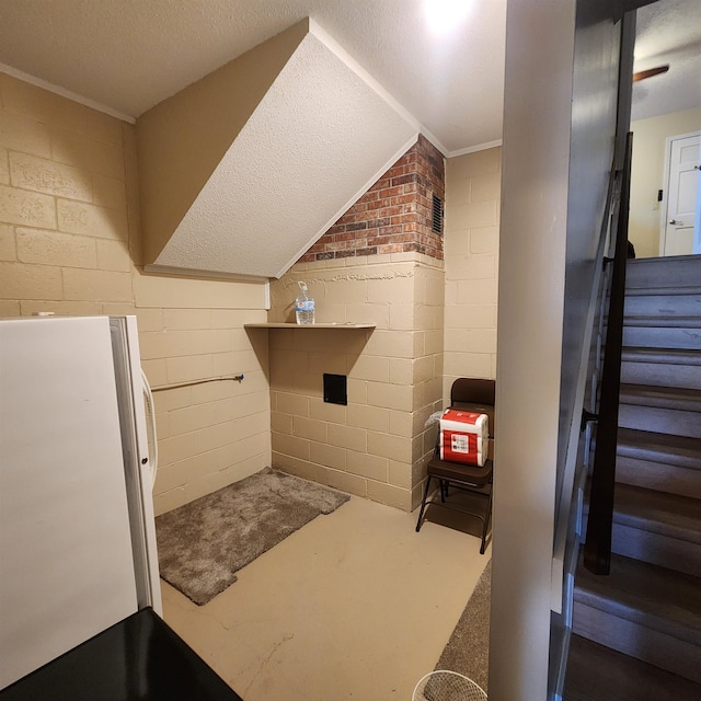 bathroom with a textured ceiling and ornamental molding