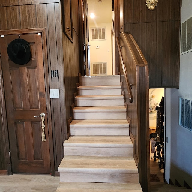 stairway featuring light wood-type flooring