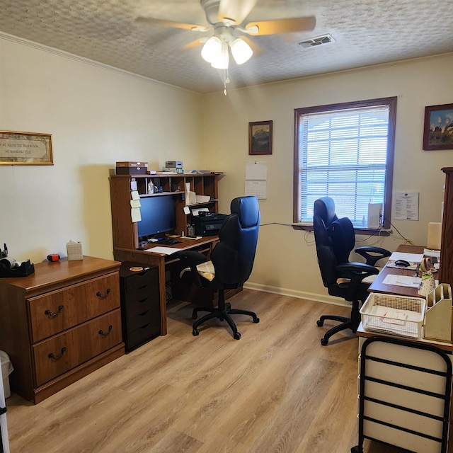 home office with ornamental molding, a textured ceiling, ceiling fan, and light hardwood / wood-style flooring