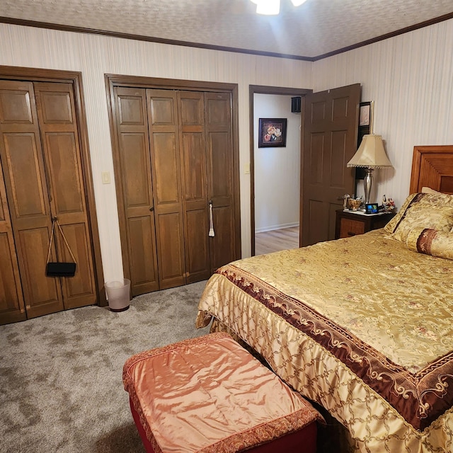 bedroom featuring light colored carpet, a textured ceiling, and crown molding