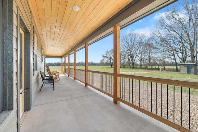 unfurnished sunroom featuring wooden ceiling