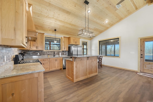 kitchen with wooden ceiling, appliances with stainless steel finishes, a center island, hardwood / wood-style flooring, and decorative backsplash