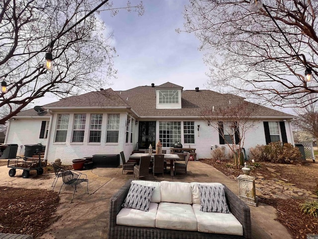 back of house with a patio area and an outdoor hangout area