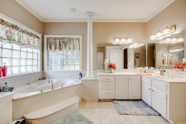 bathroom with tile flooring, decorative columns, plenty of natural light, vanity, and a bathing tub