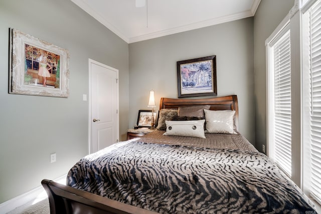 carpeted bedroom with ornamental molding