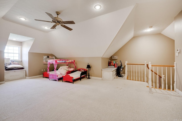 recreation room featuring light colored carpet, ceiling fan, and lofted ceiling