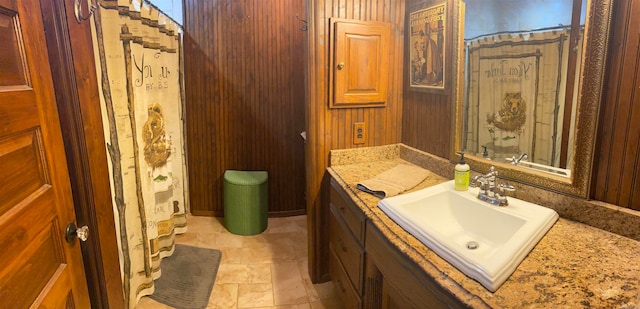 bathroom featuring tile floors and large vanity