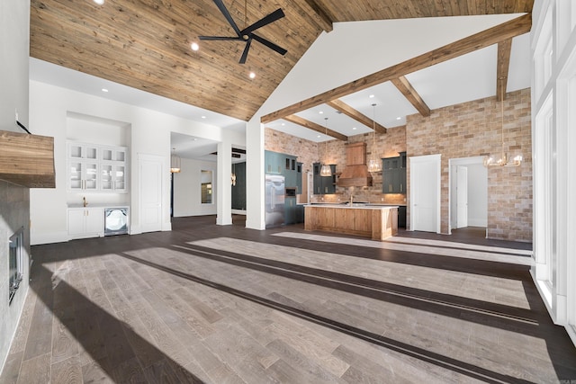 living room with dark wood-style floors, wood ceiling, ceiling fan, beamed ceiling, and high vaulted ceiling