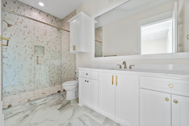 full bathroom featuring marble finish floor, vanity, a marble finish shower, and toilet