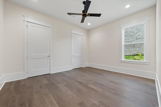 unfurnished bedroom with ceiling fan, baseboards, wood finished floors, and recessed lighting