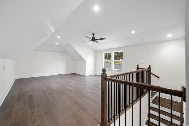 bonus room with recessed lighting, dark wood-style flooring, vaulted ceiling, and baseboards