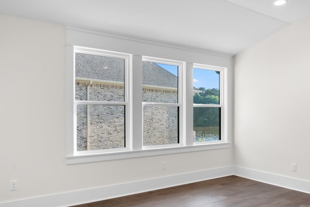 unfurnished room featuring baseboards, dark wood-style flooring, and recessed lighting