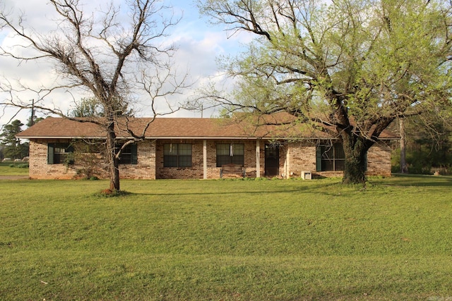 ranch-style home featuring a front yard