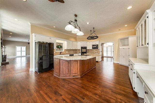 kitchen with ceiling fan, dark wood-type flooring, black appliances, and a healthy amount of sunlight