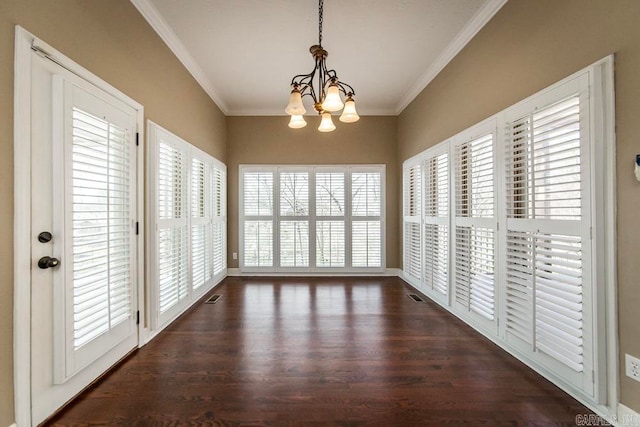 interior space featuring an inviting chandelier and a healthy amount of sunlight