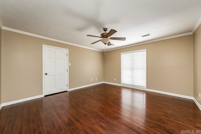 spare room featuring ceiling fan, ornamental molding, and dark hardwood / wood-style flooring