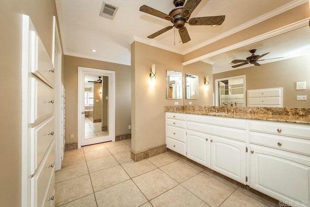 bathroom featuring tile flooring, ceiling fan, vanity, and crown molding