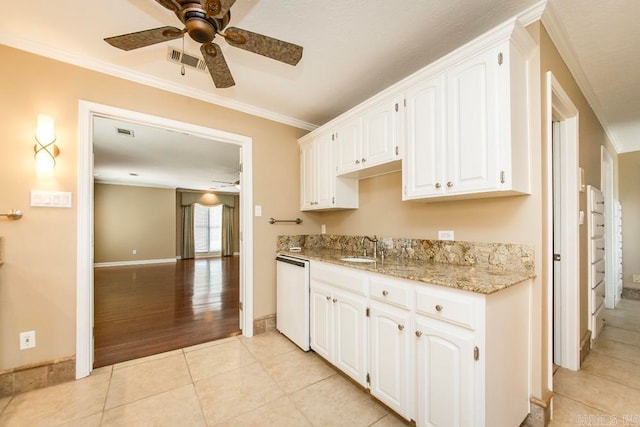 kitchen with ceiling fan, white cabinetry, ornamental molding, and white dishwasher