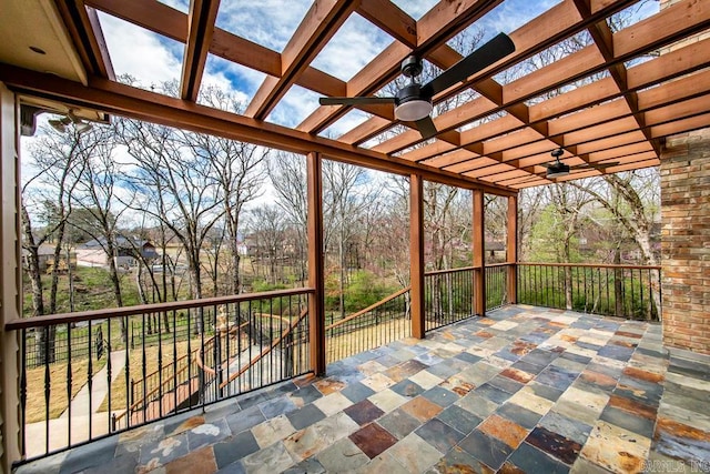 view of terrace featuring a pergola and ceiling fan