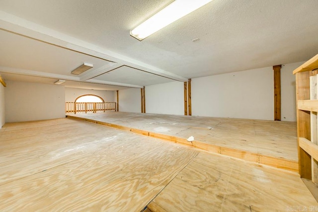 basement with a textured ceiling