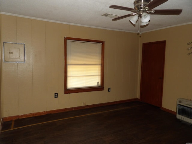 unfurnished room featuring ceiling fan, dark wood-type flooring, and ornamental molding