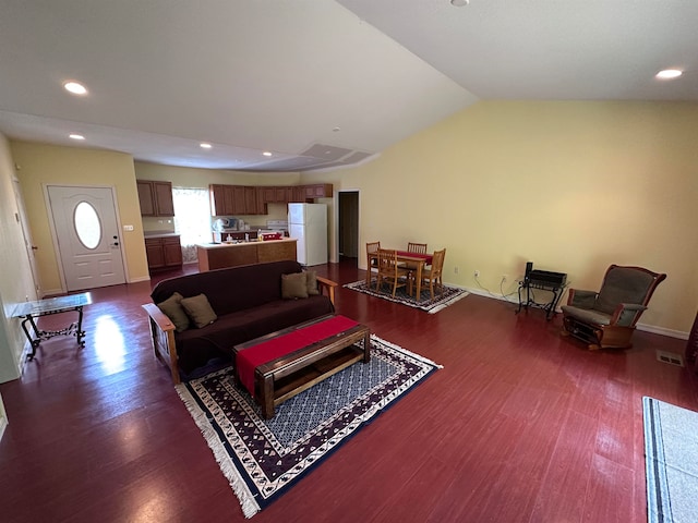 living room with lofted ceiling and dark wood-type flooring