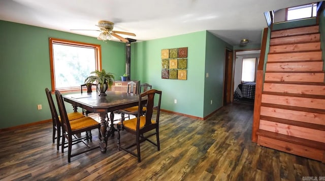 dining area featuring ceiling fan and dark wood-type flooring