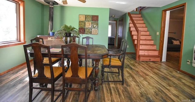 dining space featuring dark hardwood / wood-style flooring and ceiling fan