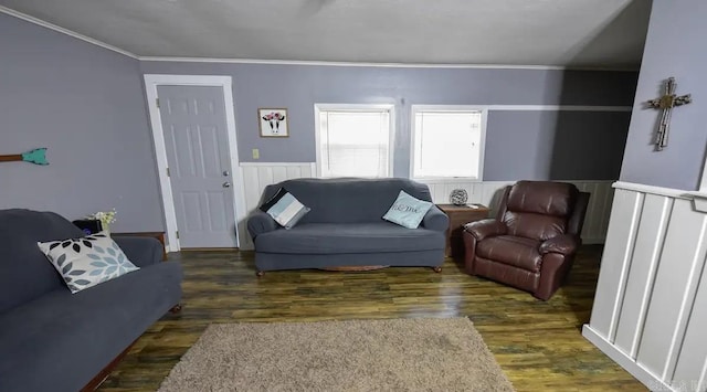 living room featuring ornamental molding and dark hardwood / wood-style flooring