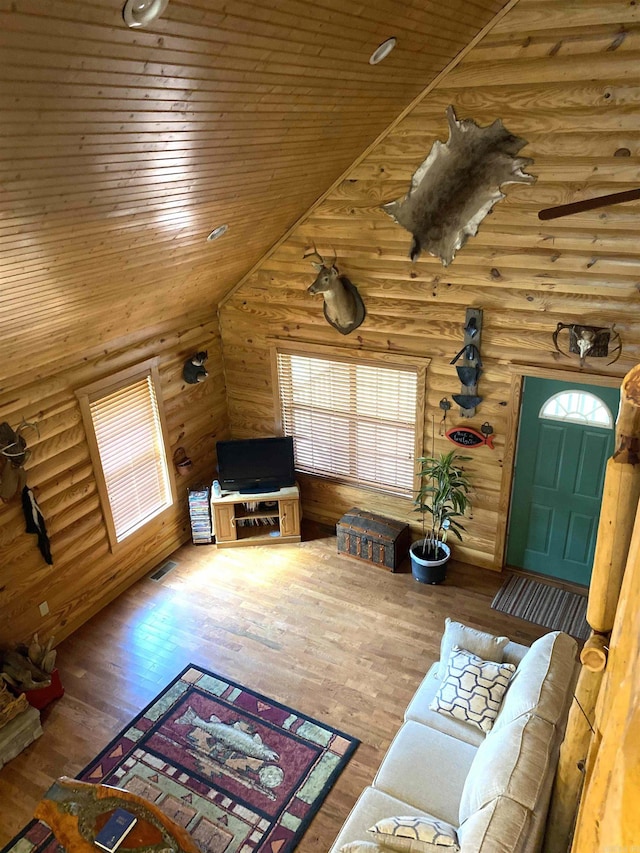 living room featuring high vaulted ceiling, hardwood / wood-style floors, and wooden ceiling