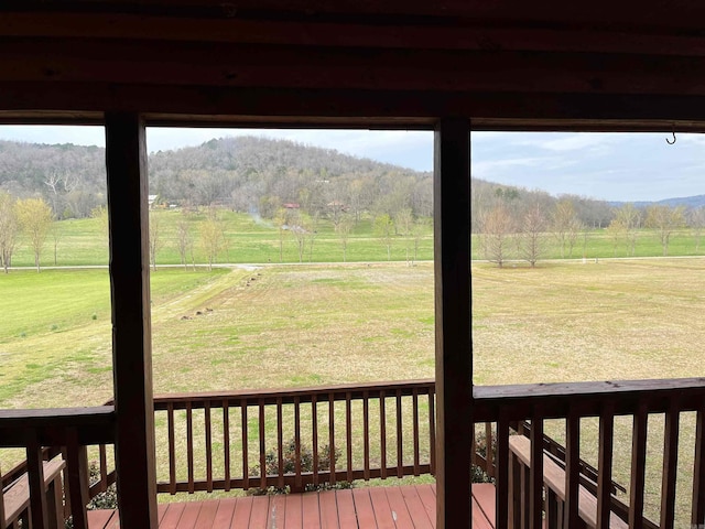 exterior space with a rural view and a yard