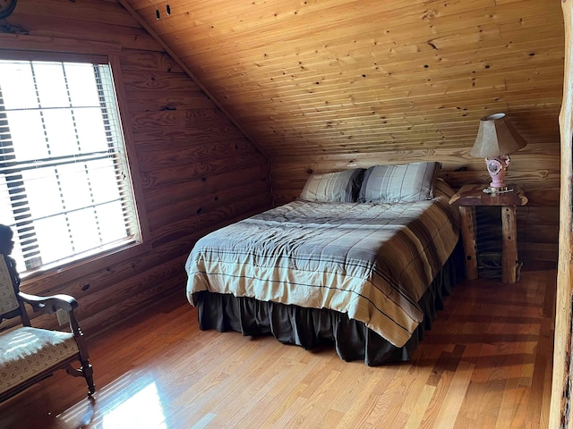 bedroom featuring multiple windows, lofted ceiling, wood ceiling, and light wood-type flooring