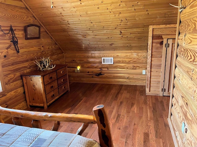 unfurnished bedroom featuring vaulted ceiling, wooden ceiling, and dark wood-type flooring