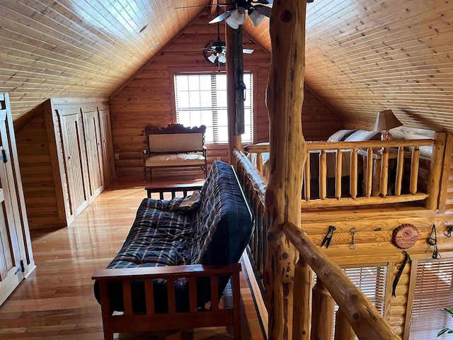 interior space featuring lofted ceiling, ceiling fan, and light wood-type flooring