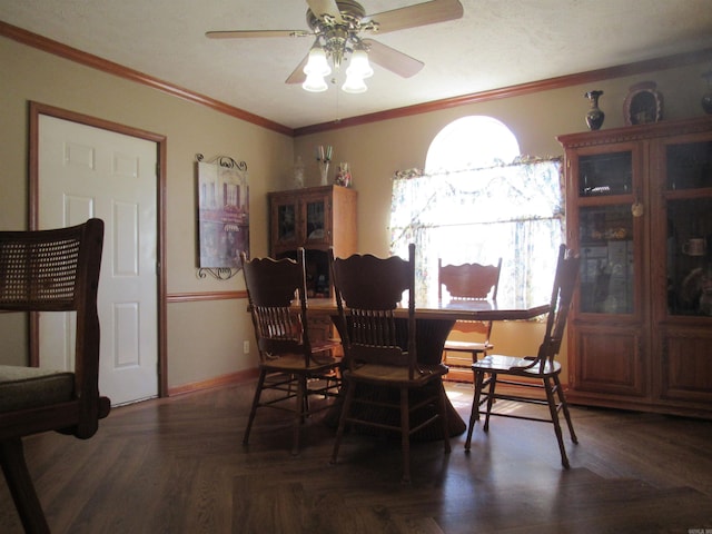 dining room featuring ornamental molding, dark parquet floors, and ceiling fan