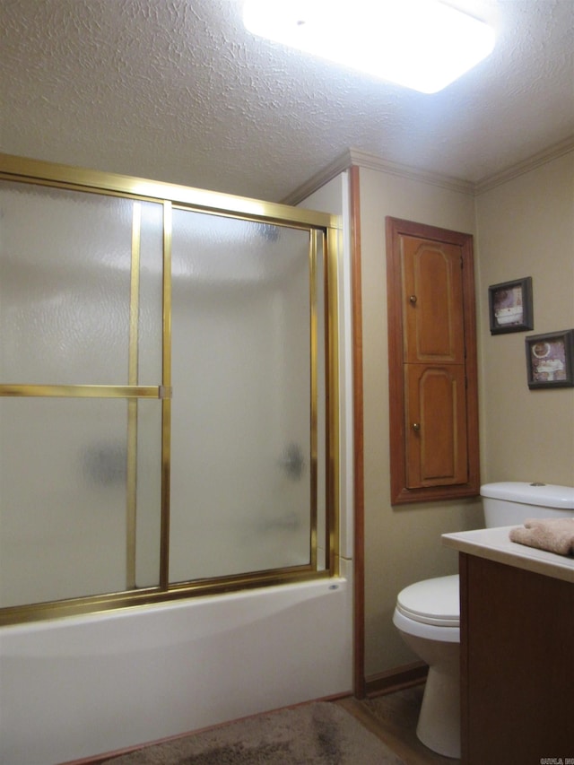 full bathroom featuring toilet, shower / bath combination with glass door, a textured ceiling, and vanity