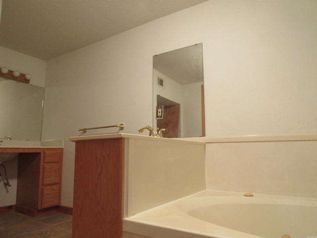 bathroom with tile floors and vanity