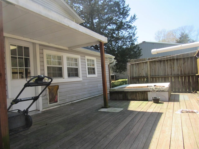 deck with a covered hot tub