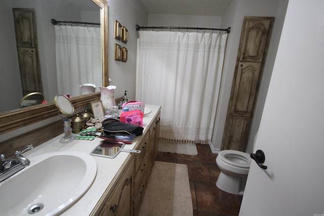 bathroom featuring tile flooring, oversized vanity, and toilet