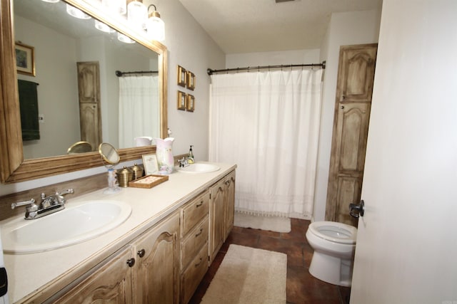 bathroom featuring toilet, tile flooring, dual sinks, and vanity with extensive cabinet space