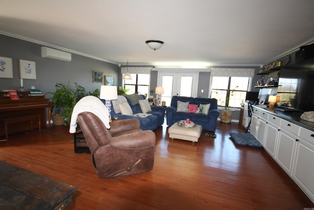 living room with a wall mounted AC, ornamental molding, french doors, and dark hardwood / wood-style flooring