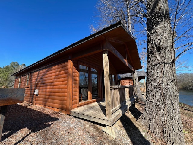 view of home's exterior with a water view