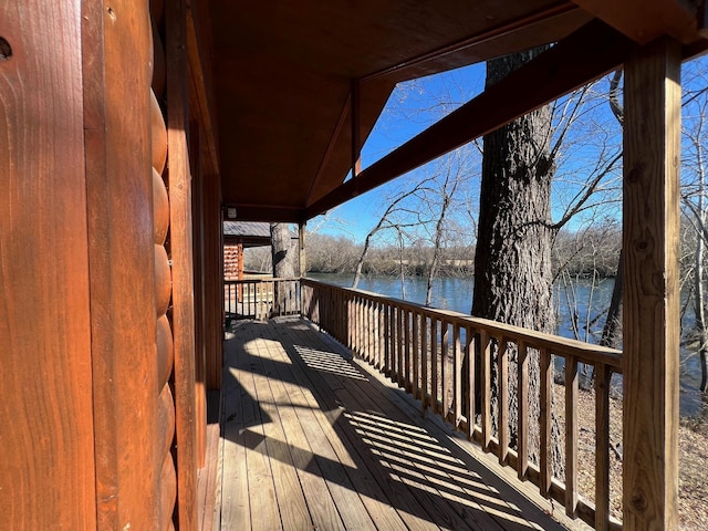 wooden deck with a water view