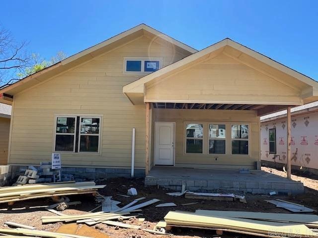 rear view of house with a patio