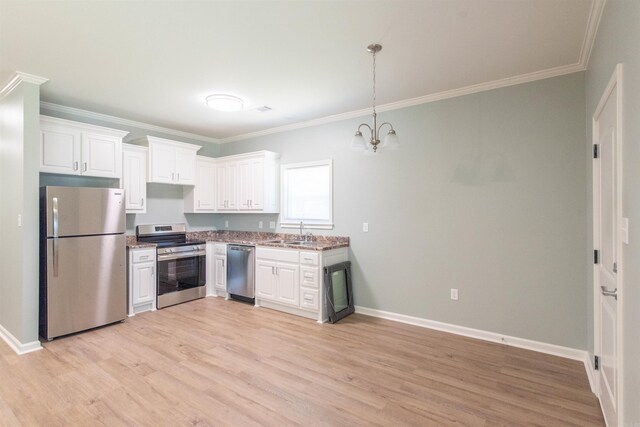 clothes washing area featuring hookup for a washing machine, dark tile flooring, electric dryer hookup, and cabinets