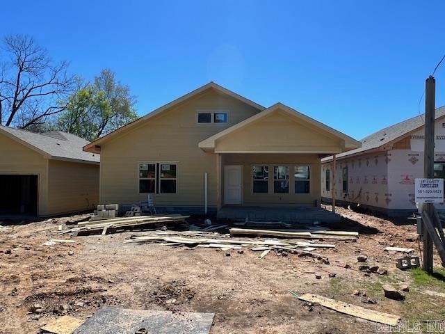 back of house with a patio